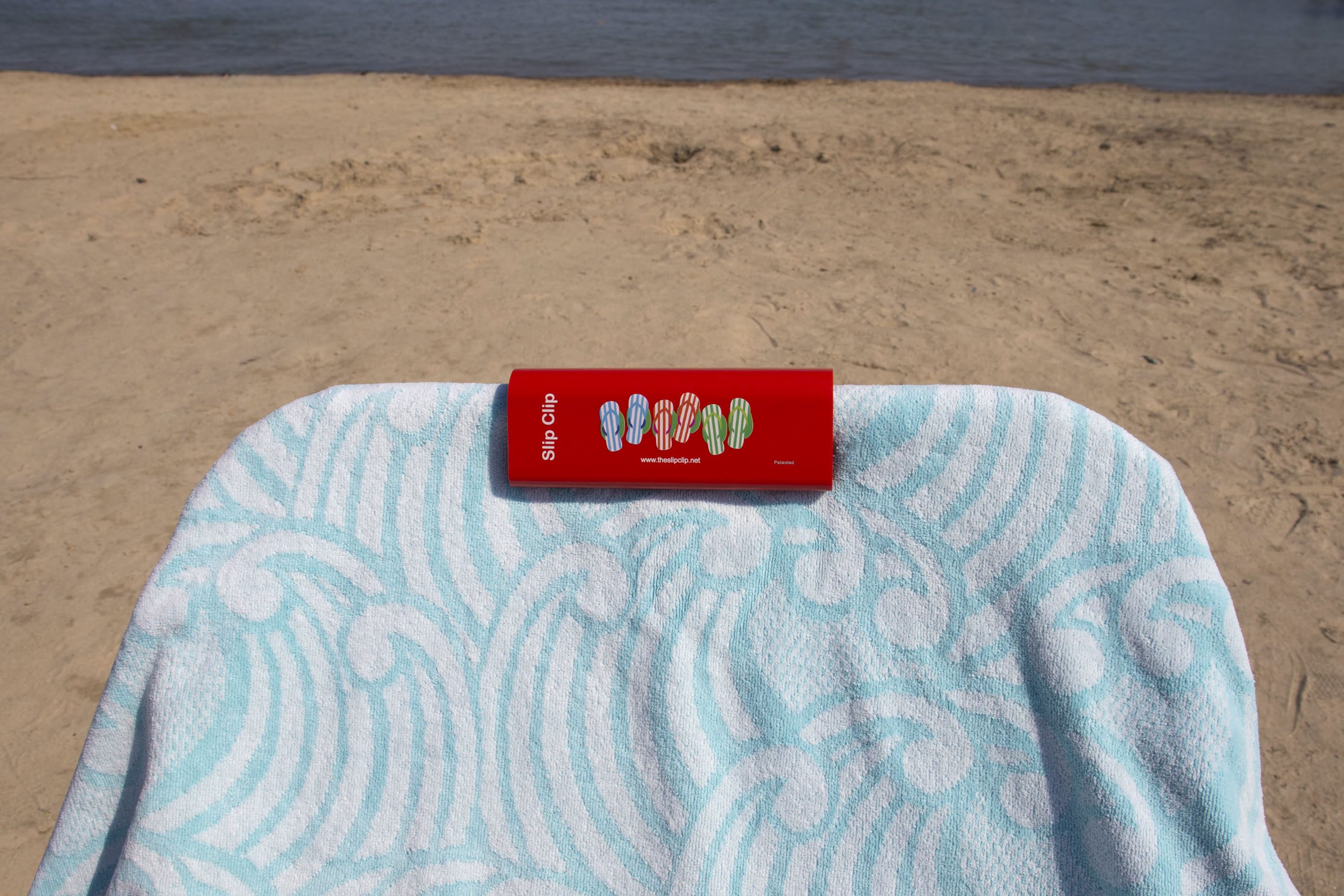 Seaside towel under sunny sky